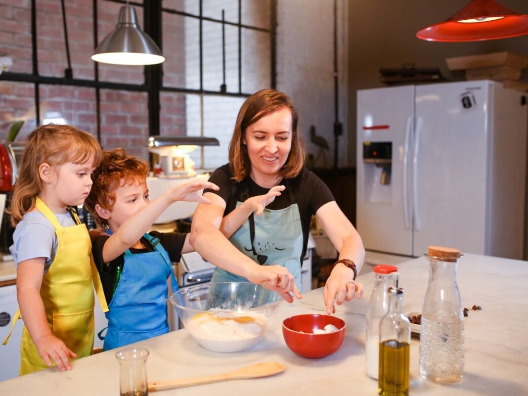 Mother and children preparing ingredients together in a kitchen